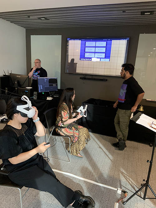 Participants and technicians prepare of a live virtual reality performance of "Corner Brook Ghost Walk: Live in V/R" at Corner Brook's Hew and Draw.